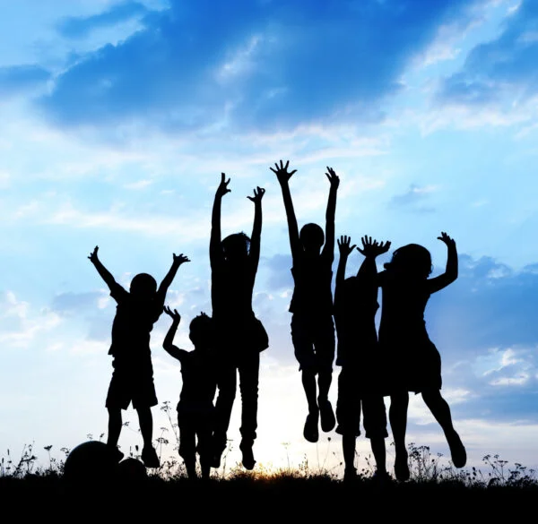 kids jumping for joy shows the joy of setting up a new charity or nonprofit