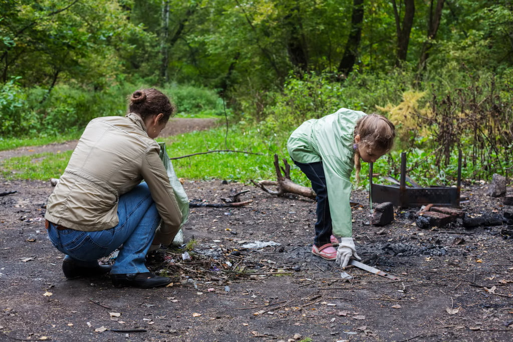 Two volunteers are cleaning up a forest trail. Is volunteering tax deductible?
