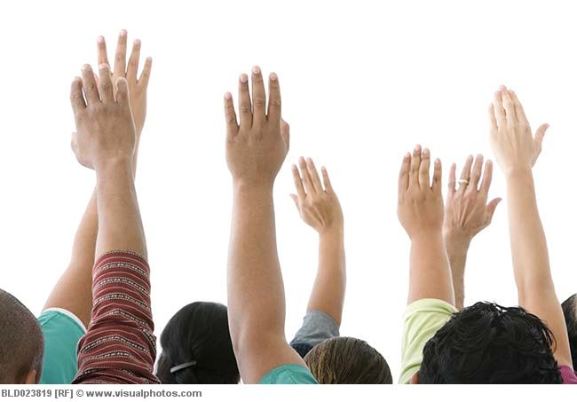 Several people are raising their hands, with many questions about losing tax-exempt status.