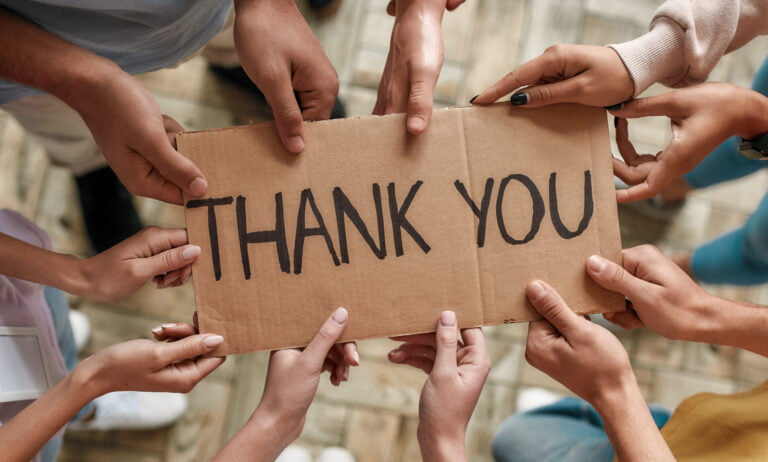 10 hands hold sign saying donor thank you